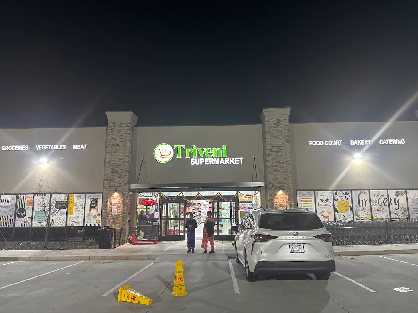 Night-time view of Triveni Supermarket, an Indian Restaurant in Katy.