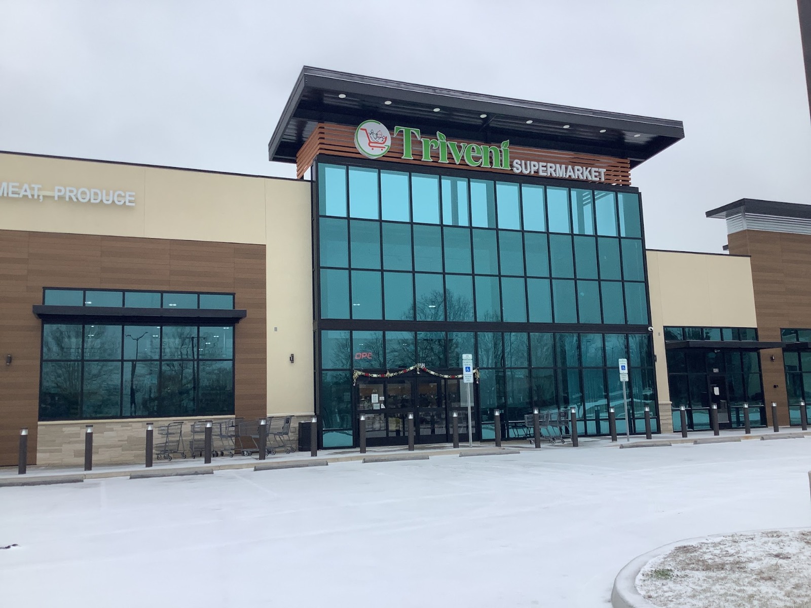 Snowy entrance of Triveni Supermarket, an Indian Restaurant in Tega Cay, SC.